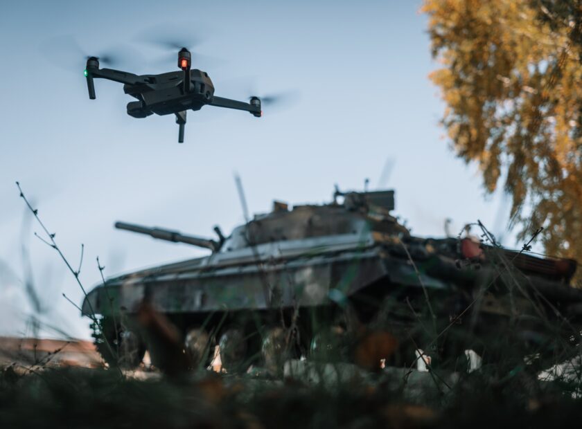 A,Drone,Flying,Above,The,Tank,In,The,Background,In